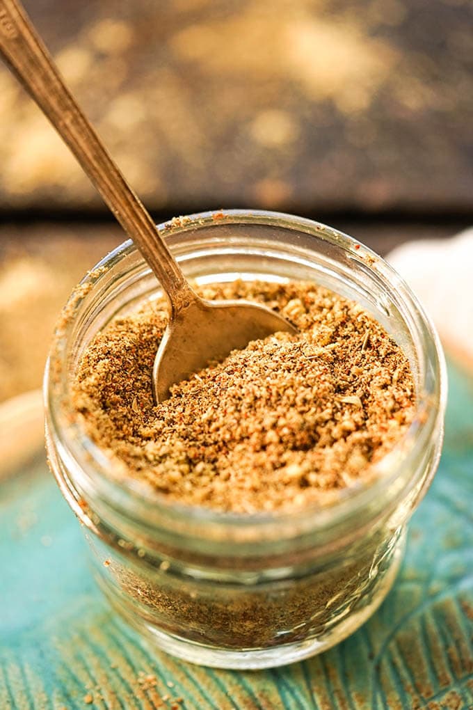 Old Bay Spice Mix in jar with spoon.