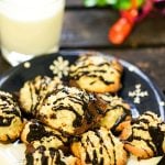 Chocolate Dipped Coconut Macaroons on plate with milk.