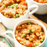 White bowls filled with Instant Pot Beef Barley Soup
