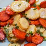 Oven Baked Carrots on platter garnished with mint.