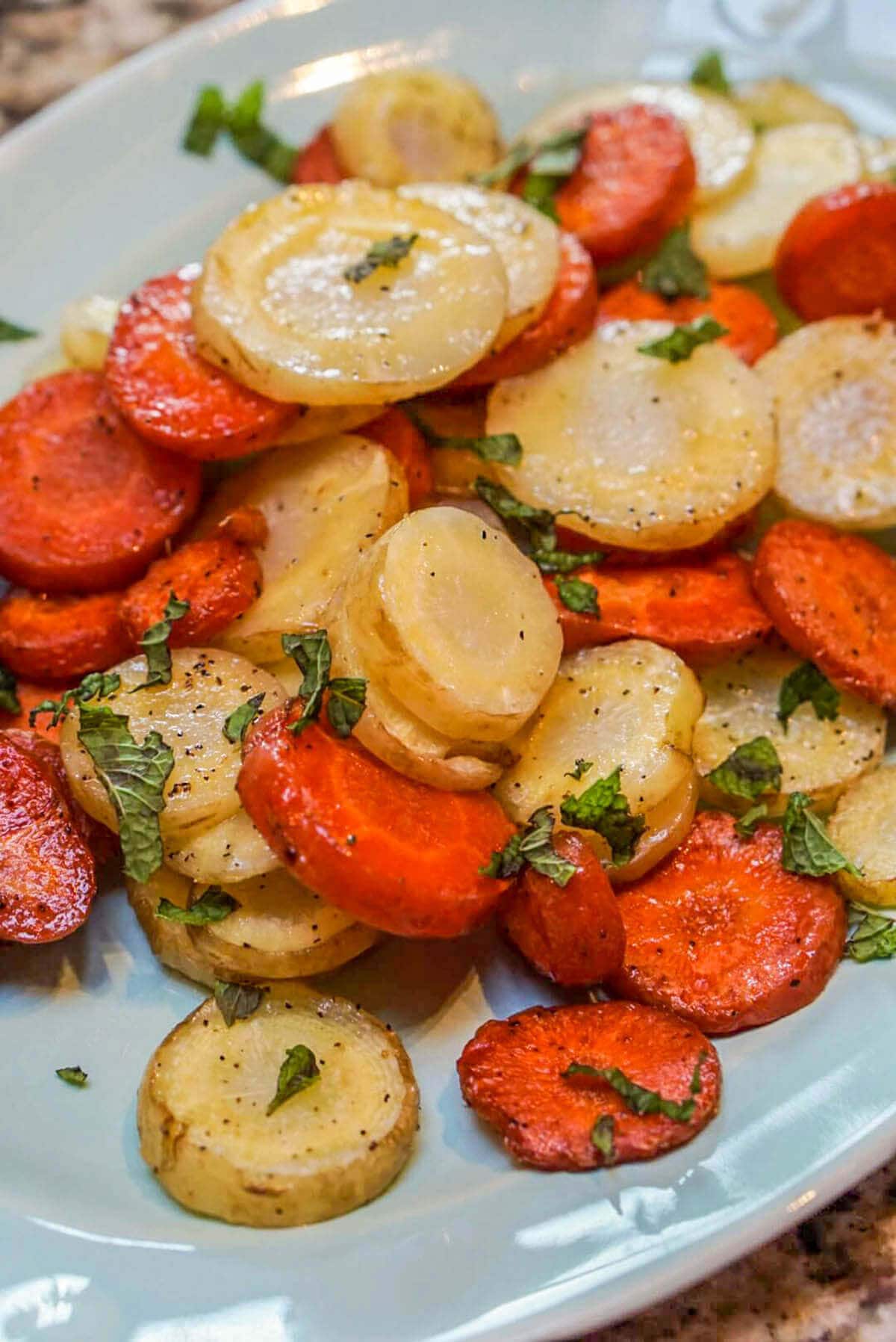 Oven Baked Carrots on white platter.