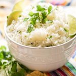 White rice in bowl topped with cilantro.