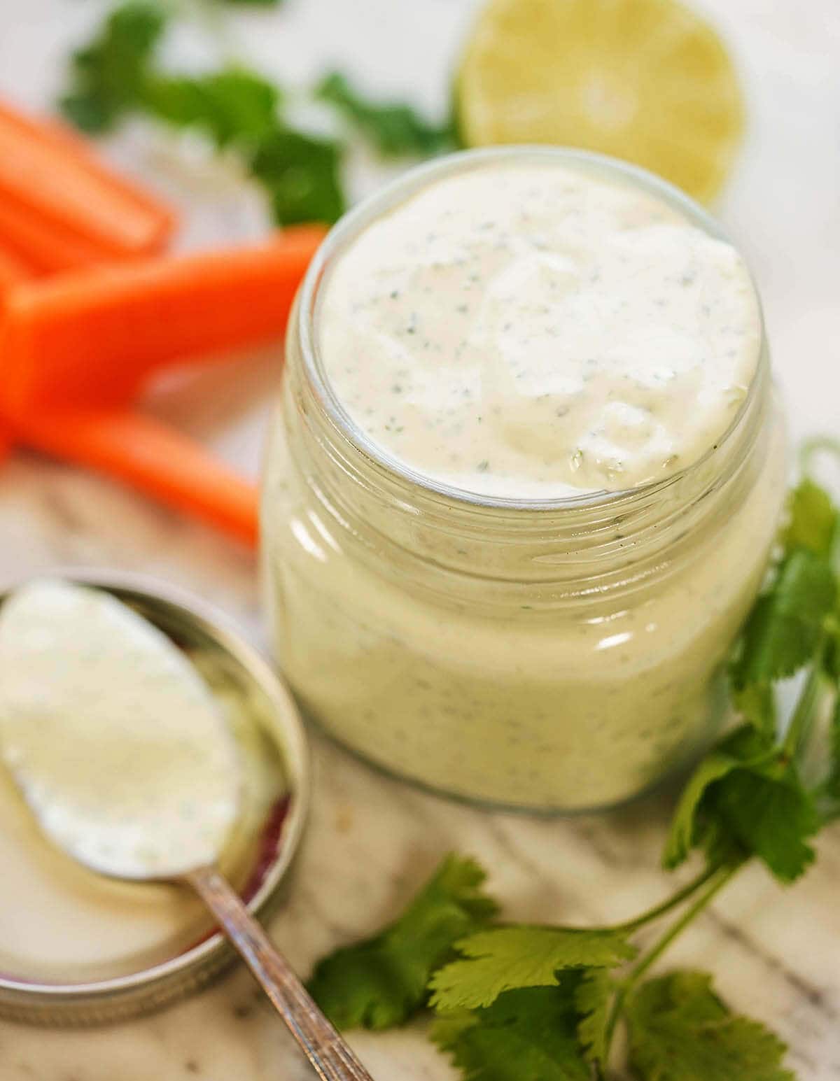 Dip in a glass jar with spoon and carrots for dunking.