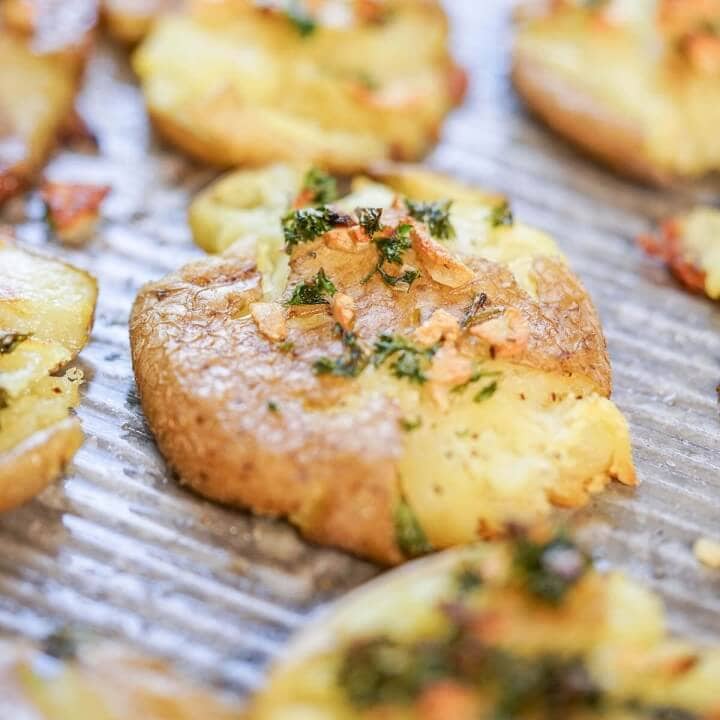 Crispy Smashed Garlic Fingerling Potatoes Recipe - Bowl Me Over