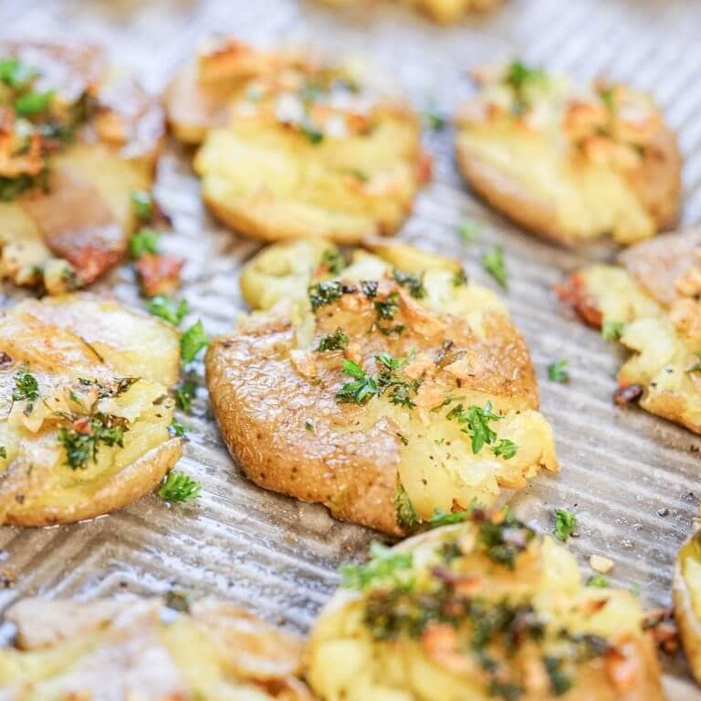 Crispy Smashed Garlic Fingerling Potatoes Recipe - Bowl Me Over