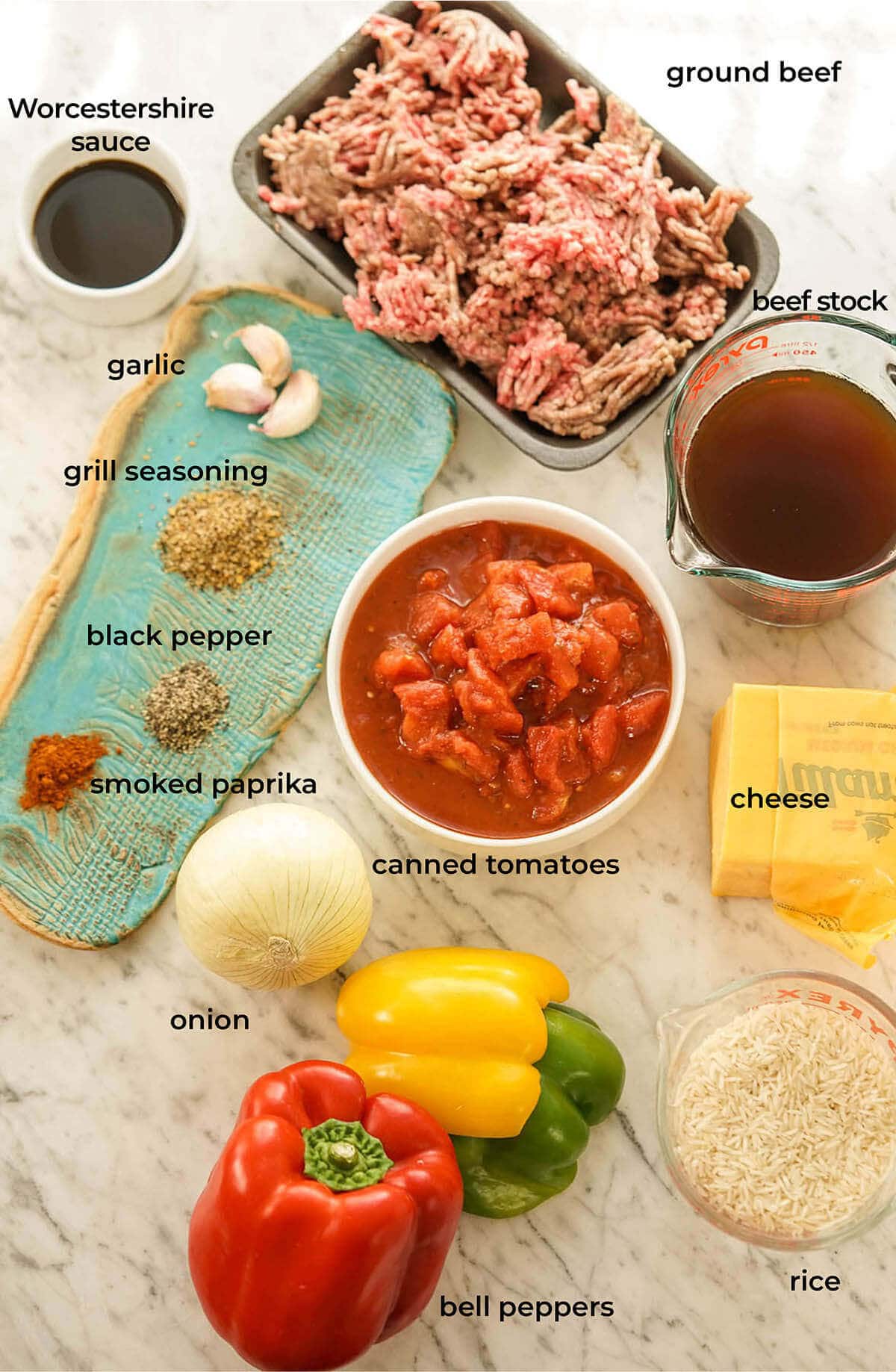 A photo with all of the ingredients laid out to make a bell pepper casserole.