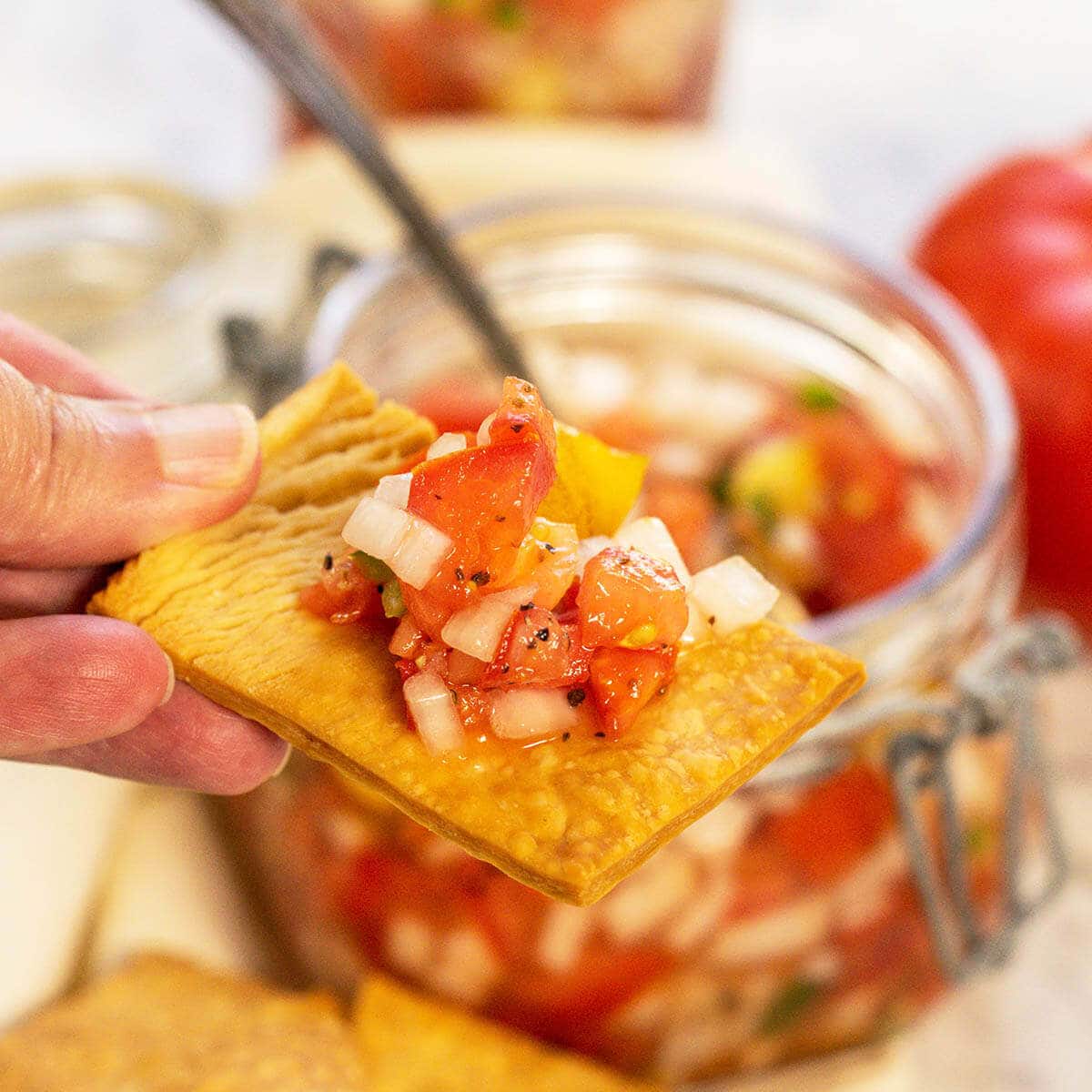 A serving of tomato relish on a cracker.