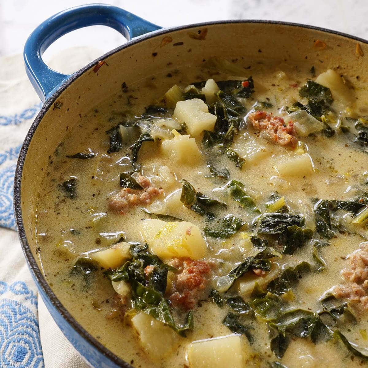 A soup pot filled with Zuppa Toscana Soup