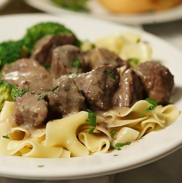Beef tips with gravy over egg noodles.