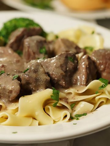 Beef tips with gravy over egg noodles.
