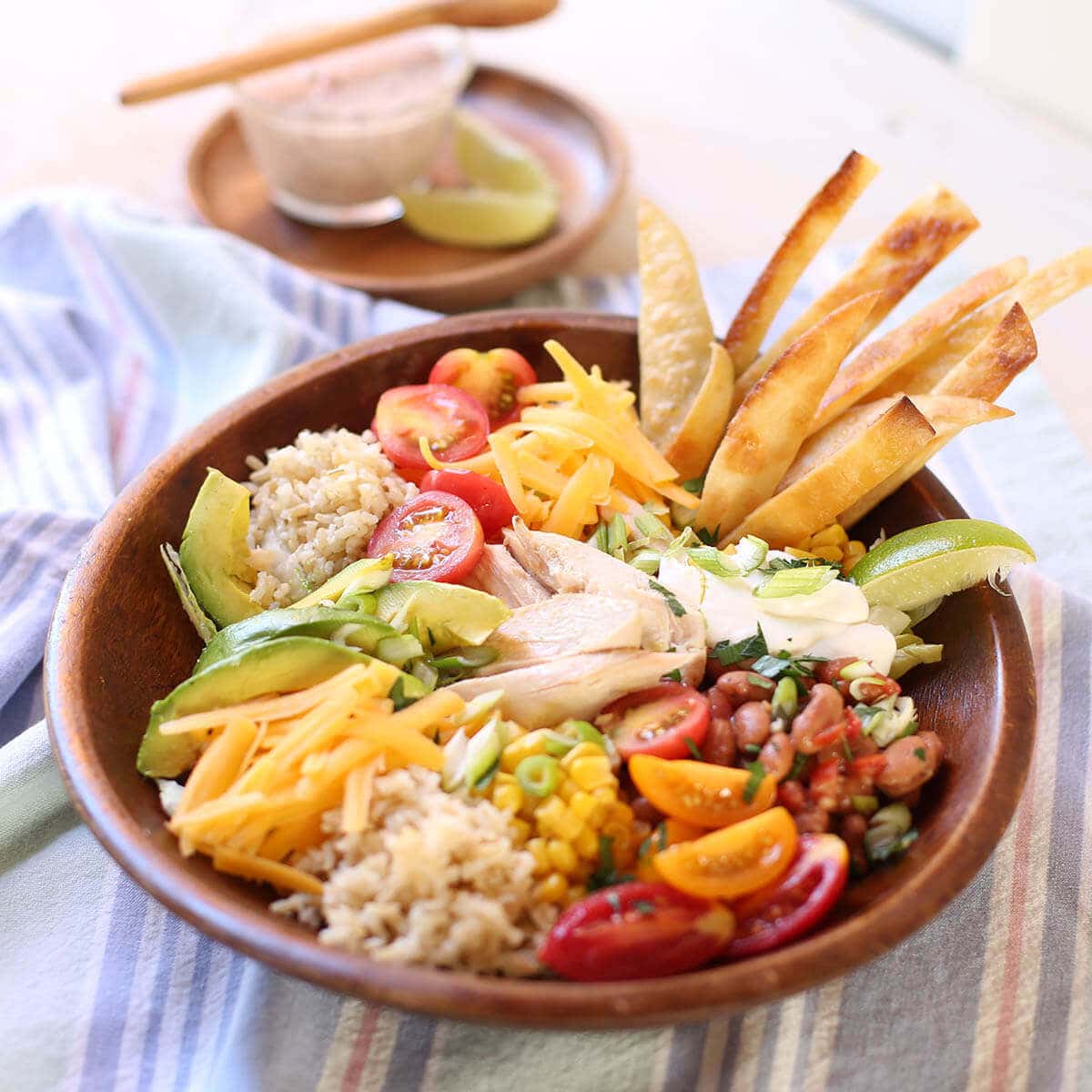 Rotisserie Chicken Burrito Bowl with salad dressing.