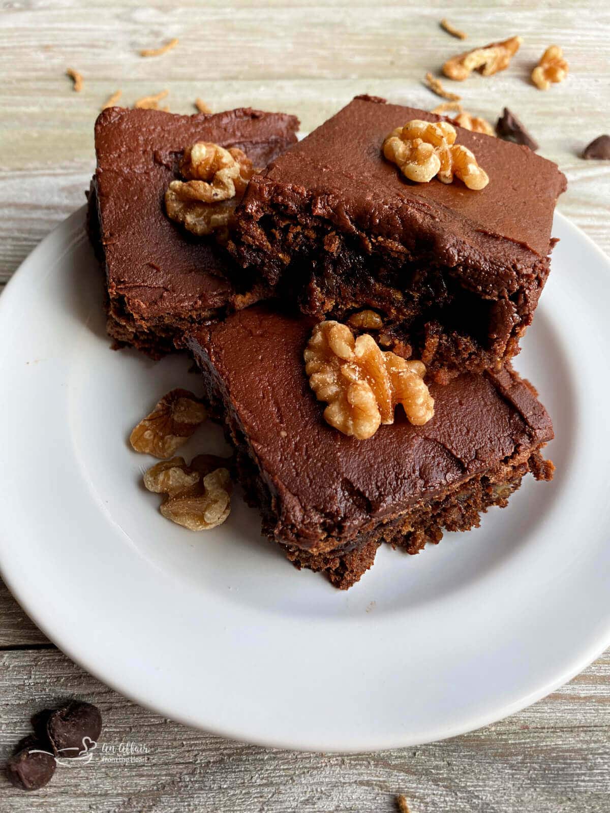 Chocolate Bar Cookies topped with walnuts.