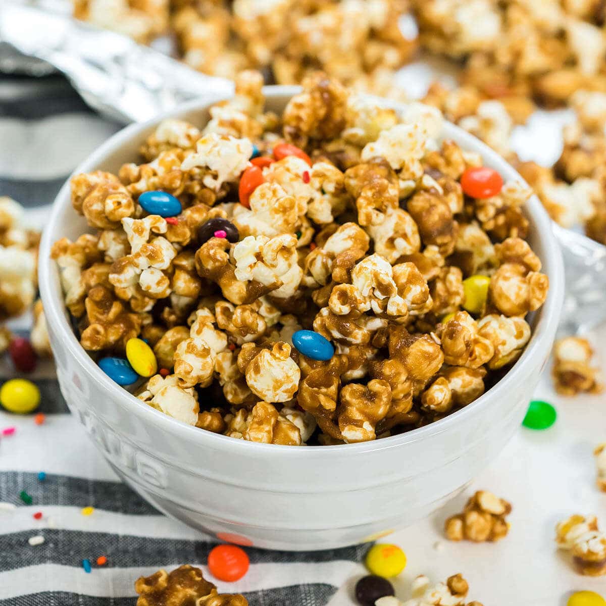 Caramel Popcorn topped with candy and sprinkles.