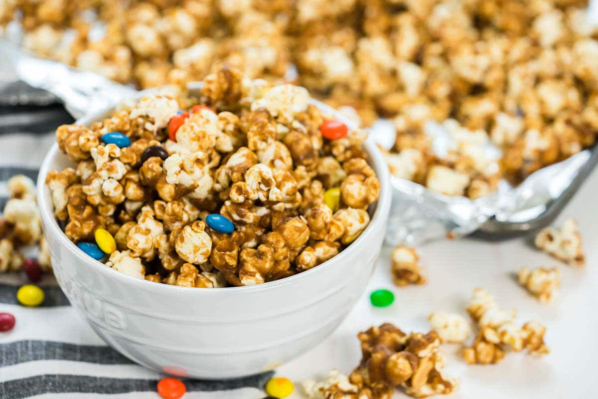 A big bowl filled with homemade caramel popcorn.