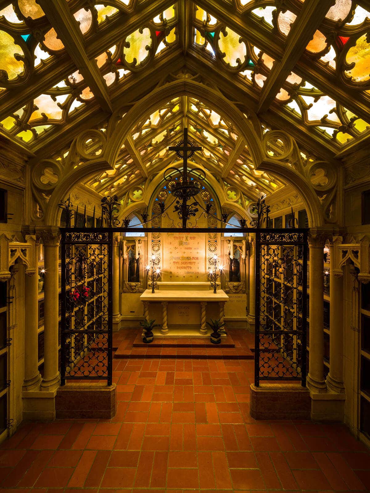 Beautiful chapel with stained glass windows and an altar at the front. 