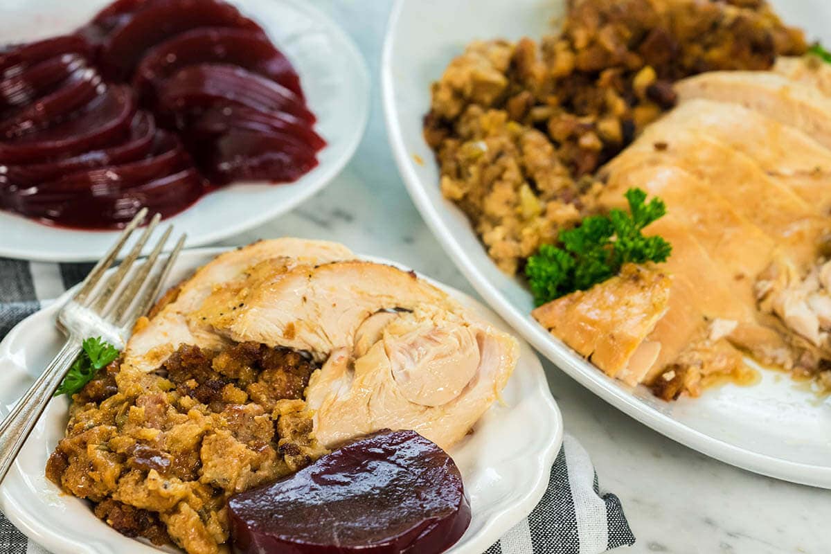 A plate filled with Crockpot Stuffed Turkey Breast.