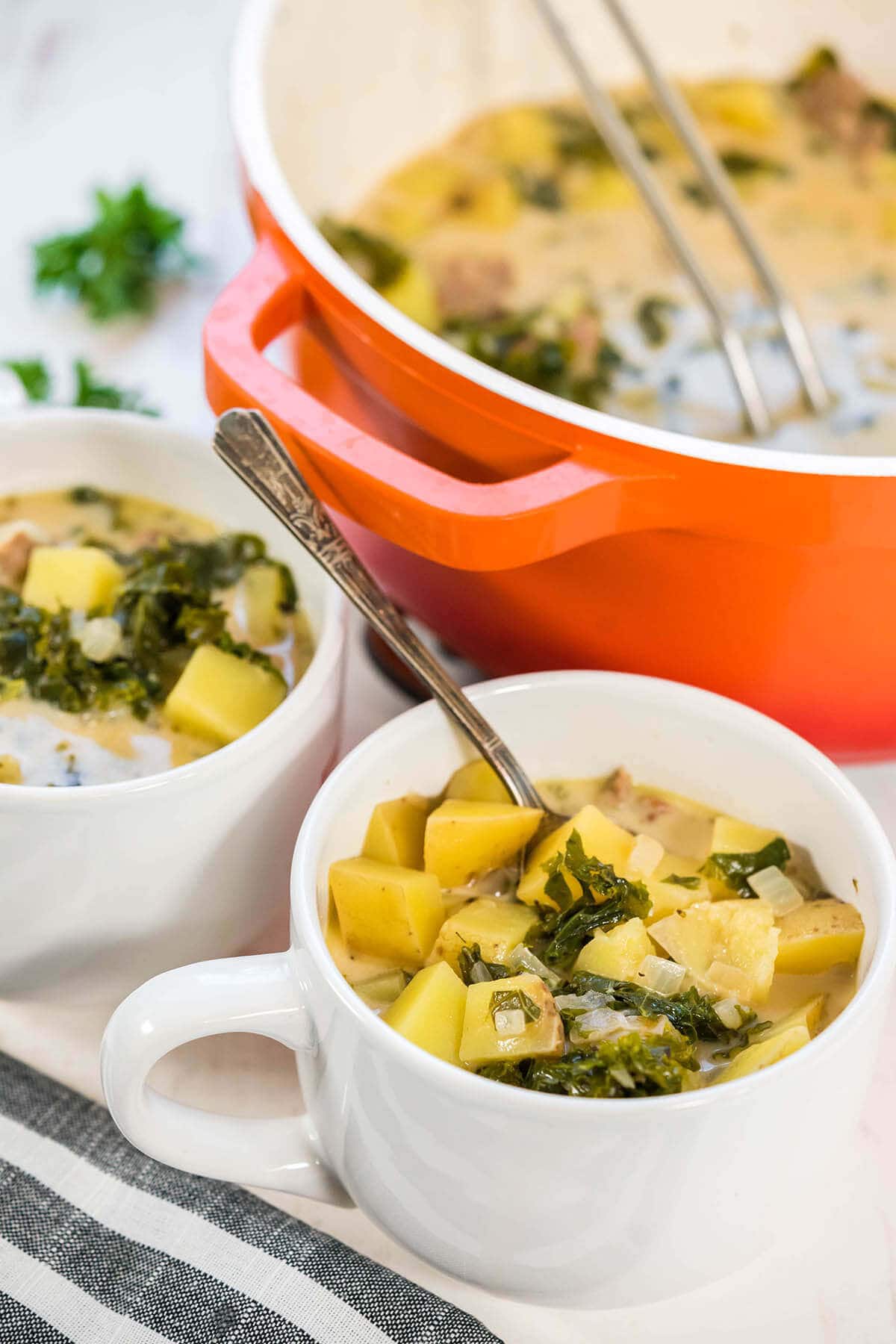 Bowls filled with Italian Sausage Potato Soup