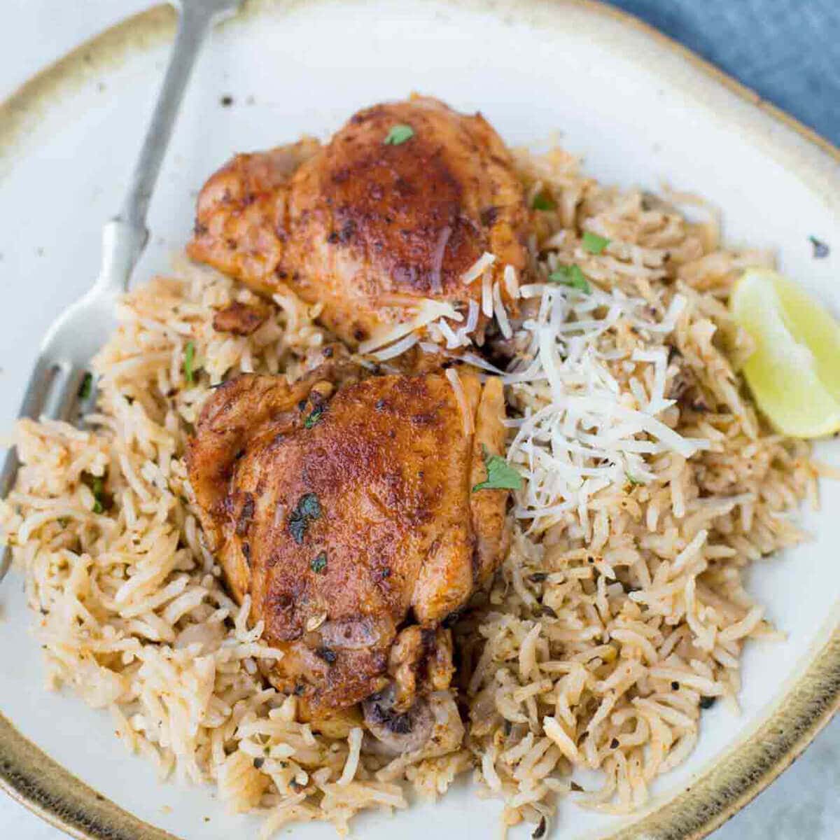 Garlic Herb Chicken on place served over brown rice. 