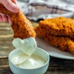 Chic-fil-A Chicken Strips dipped in creamy sauce.
