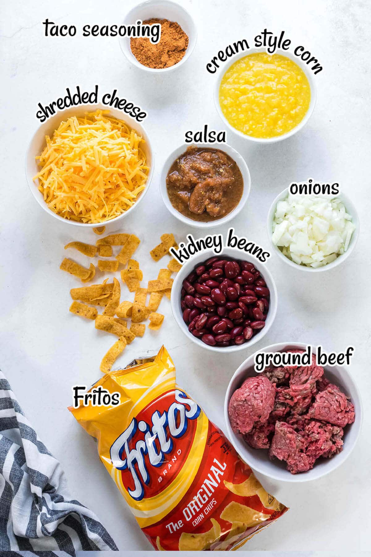 All of the ingredients laid out to make Frito Pie Casserole