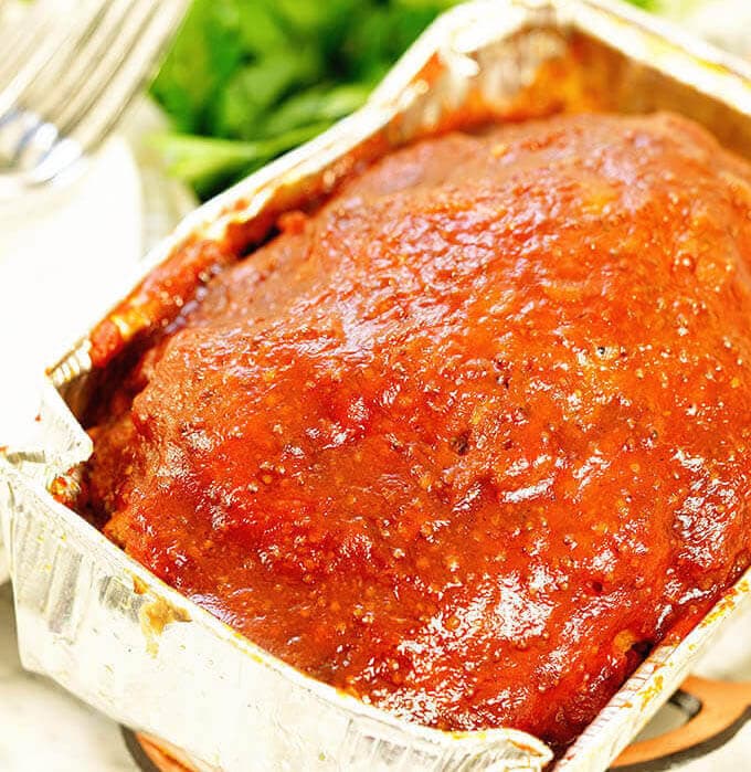 Baked meatloaf in aluminum pan. 
