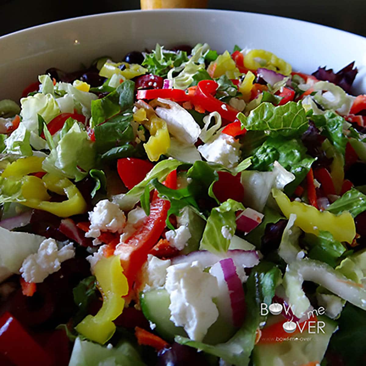 Big white bowl filled with greek salad