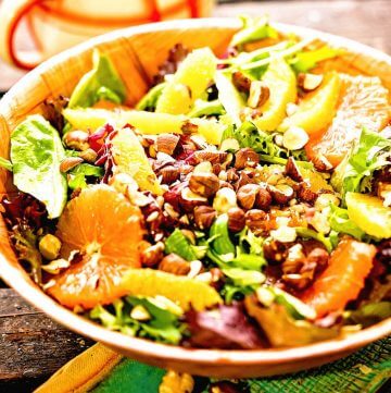 Citrus Green Salad topped with nuts.