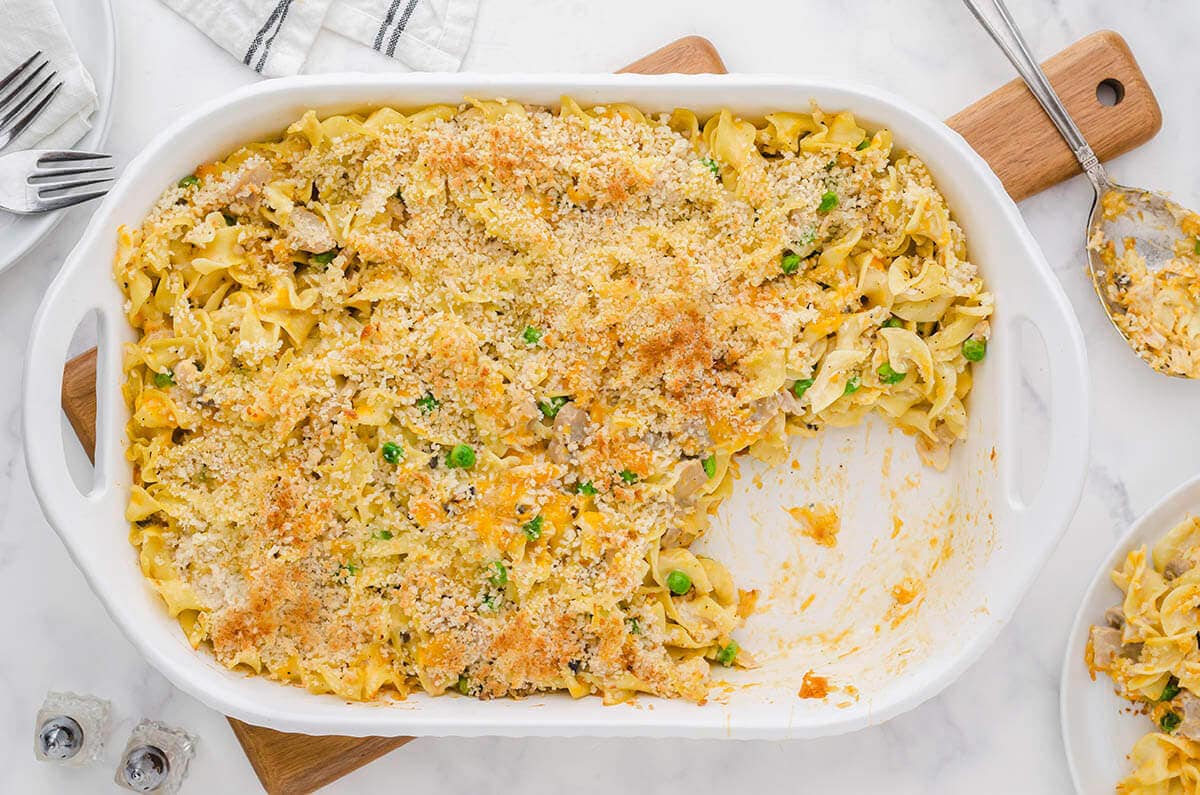 Overhead photo of baked casserole dish, with a serving removed. 