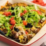 Dish filled with Taco Salad Casserole.