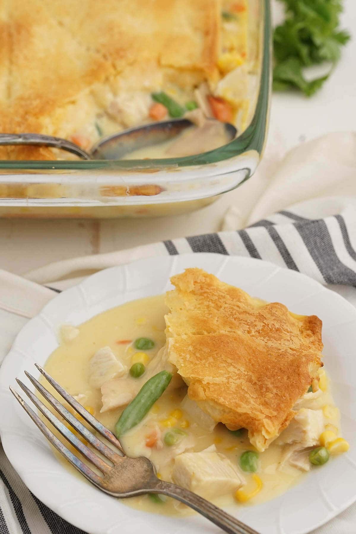 Chicken Pot Pie Casserole on plate with fork. 