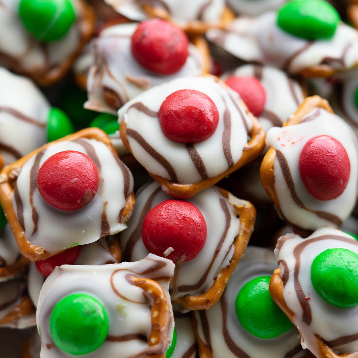 A bowl filled with Christmas Hershey Kiss Hugs.