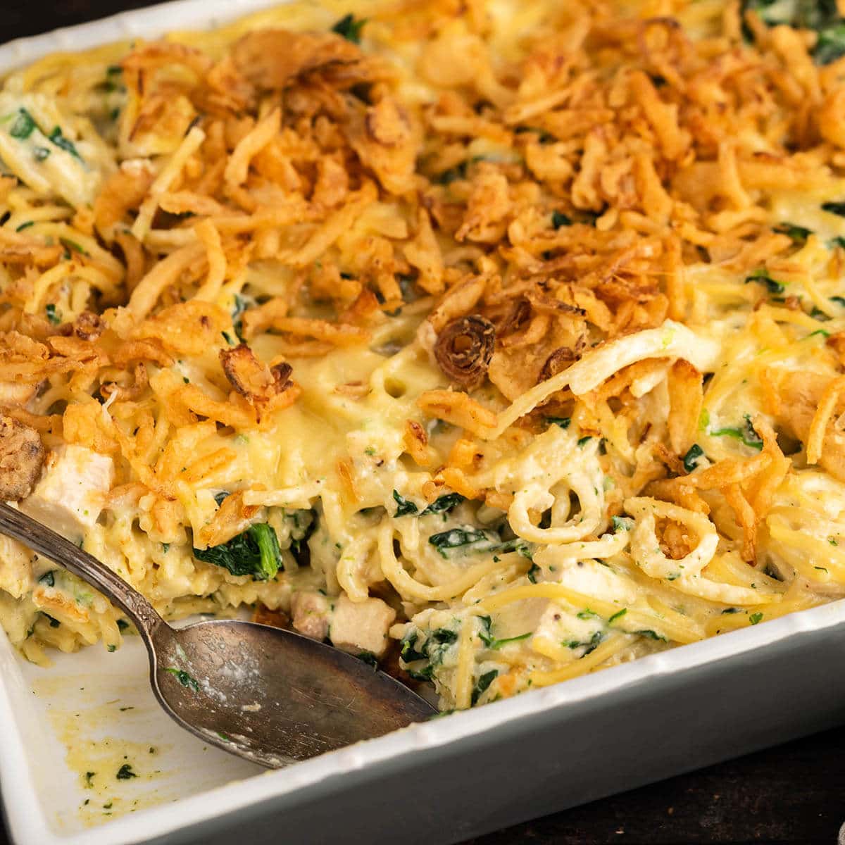 Monterey Spaghetti in baking dish with serving spoon.