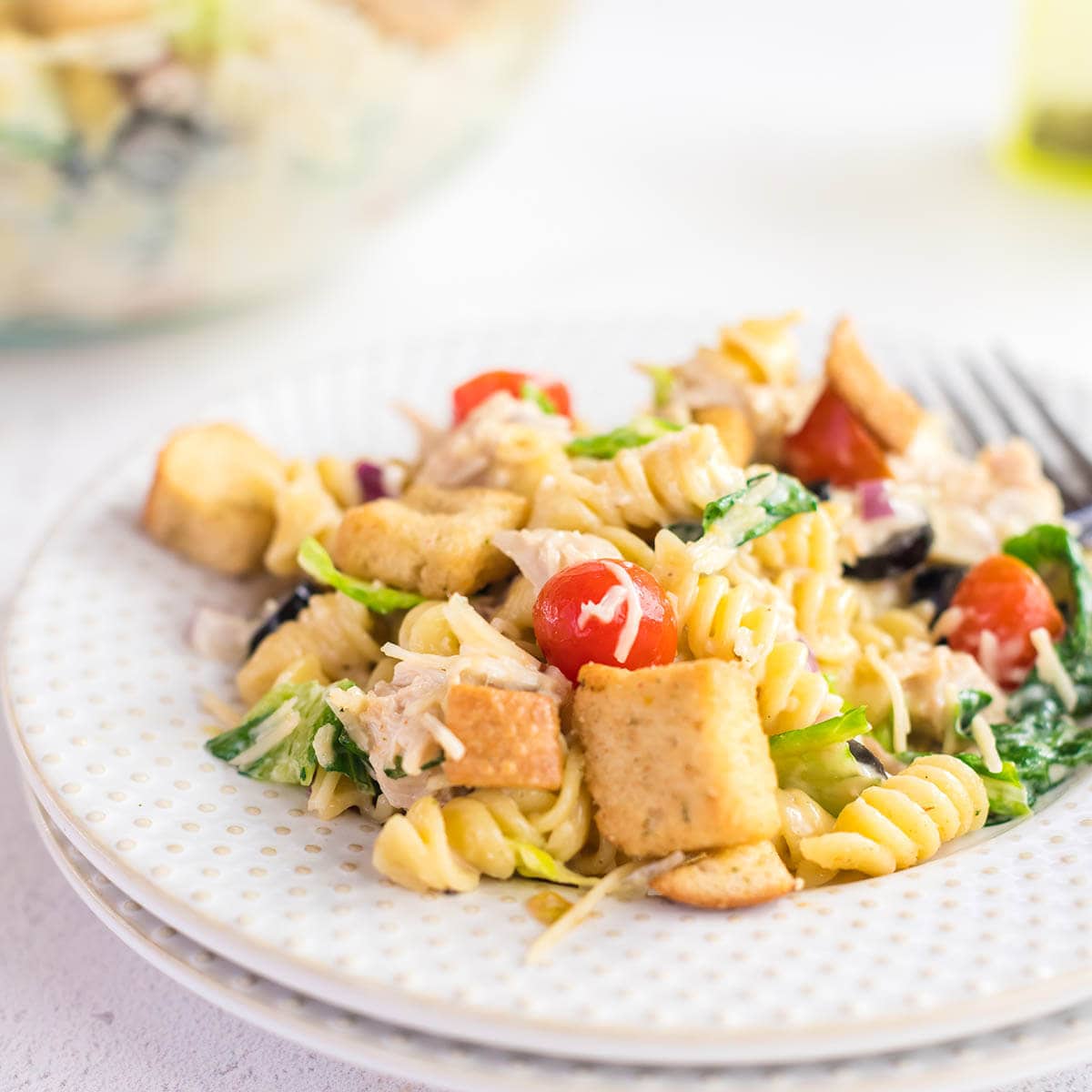 Chicken Caesar Pasta Salad on plate with fork.