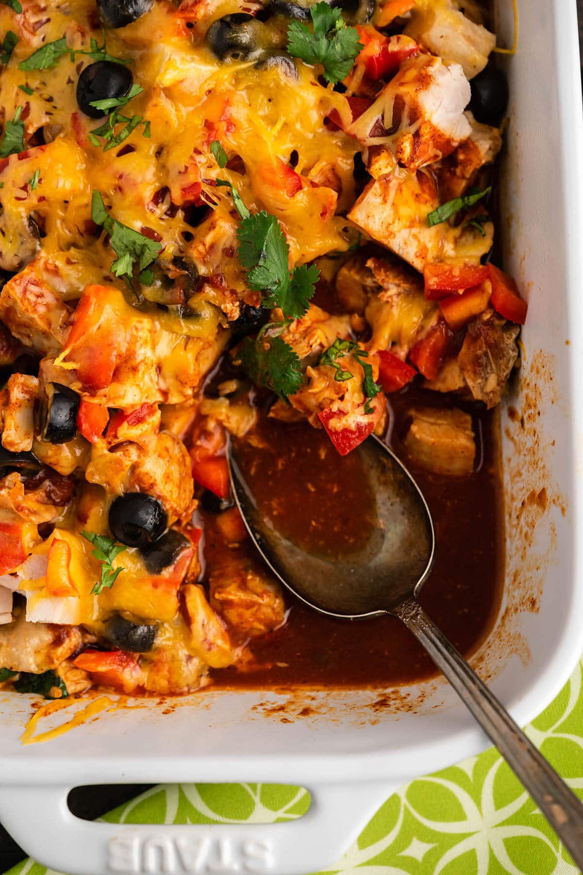 Low Carb Chicken Enchilada Casserole with serving spoon.