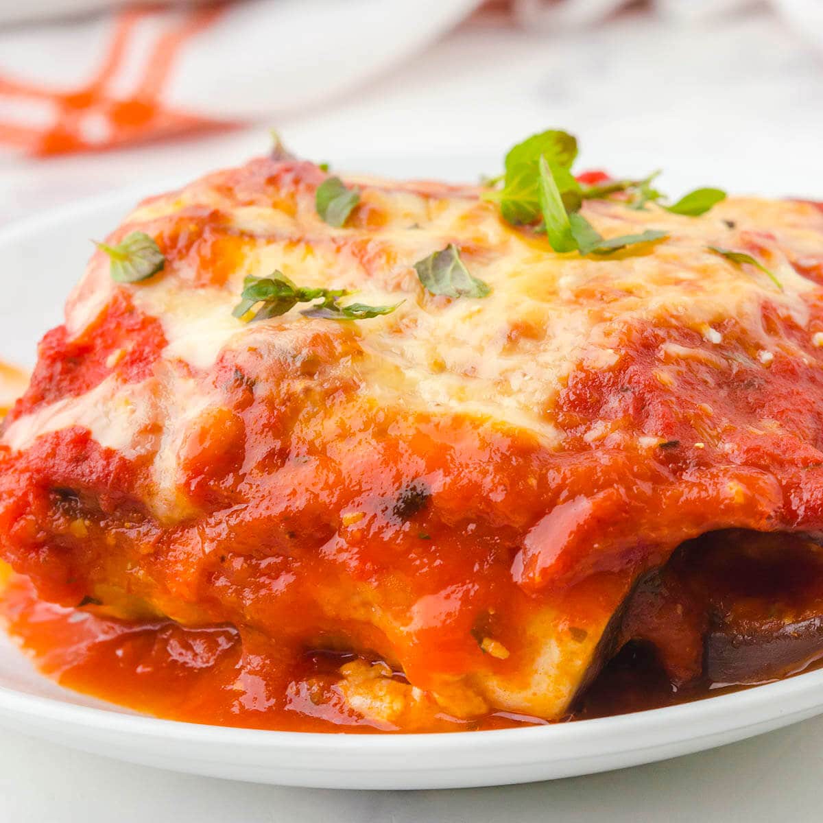 A serving of eggplant rollups on plate.