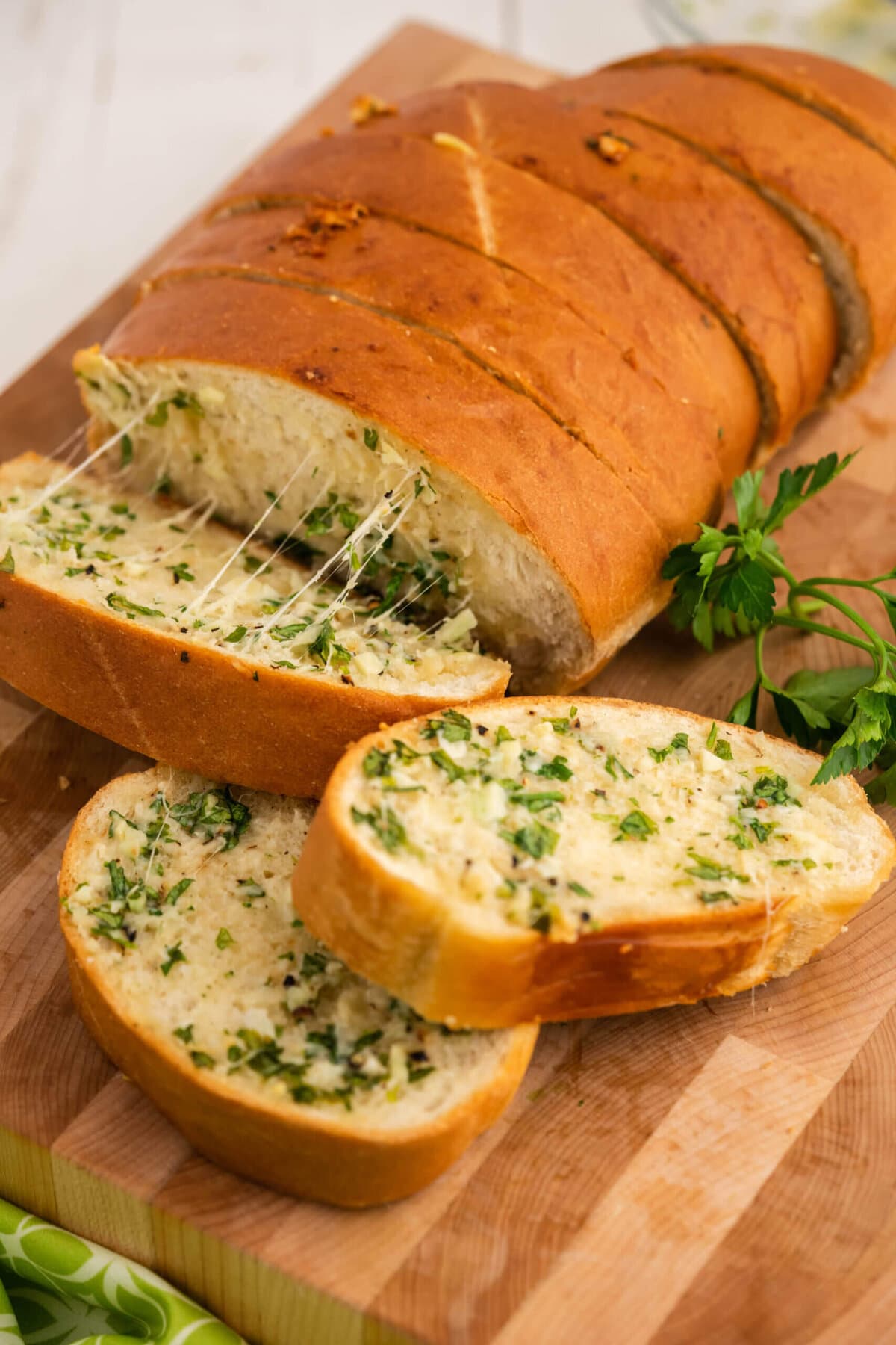 Sliced Garlic Stuffed Cheesy Bread on cutting board. 