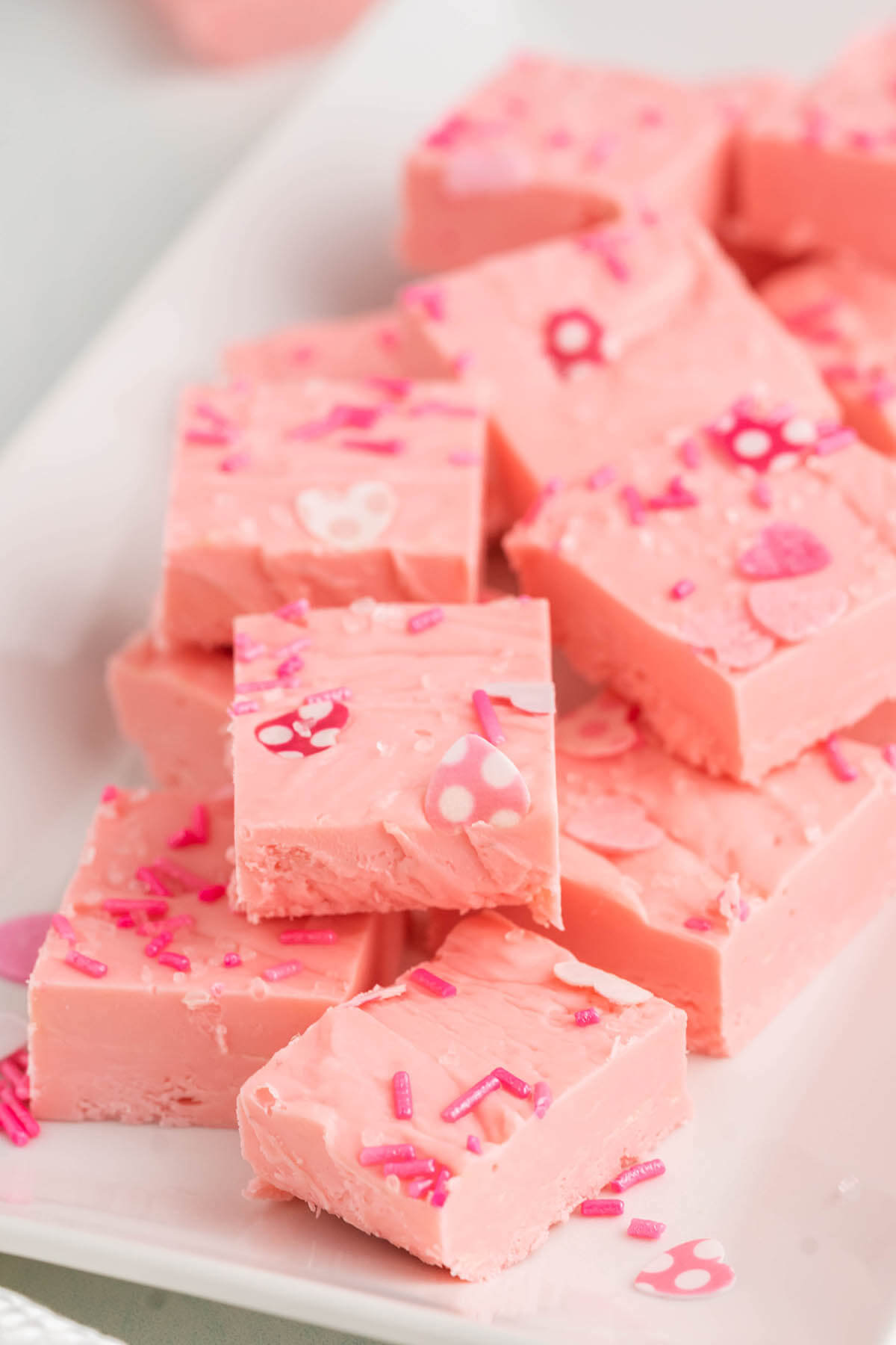 Pink candy on white platter.