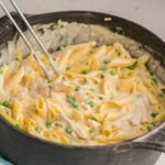 Alfredo Chicken Pasta with peas in large stock pot.