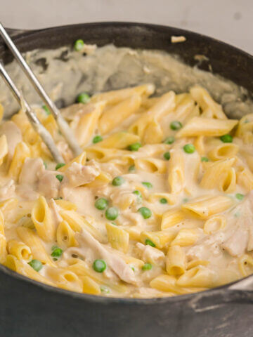 Alfredo Chicken Pasta with peas in large stock pot.