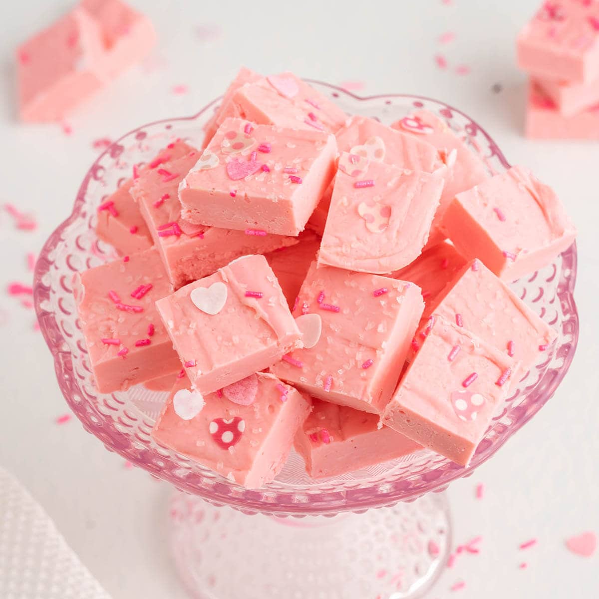 Strawberry fudge stacked in pretty bowl.