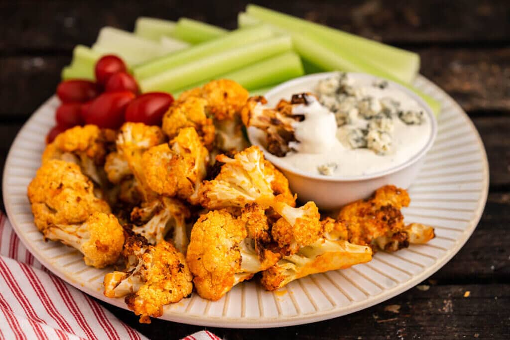 Cauliflower appetizer on platter with blue cheese dip. 