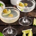 Martinis in glass with olives.