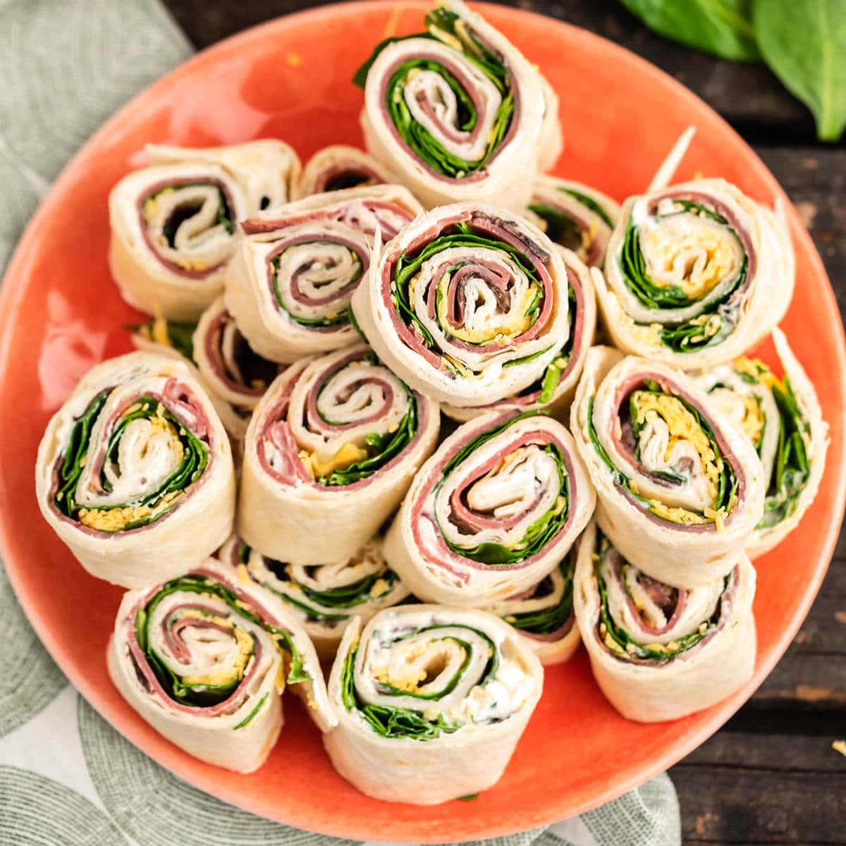 Platter of roast beef tortillas sandwiches.