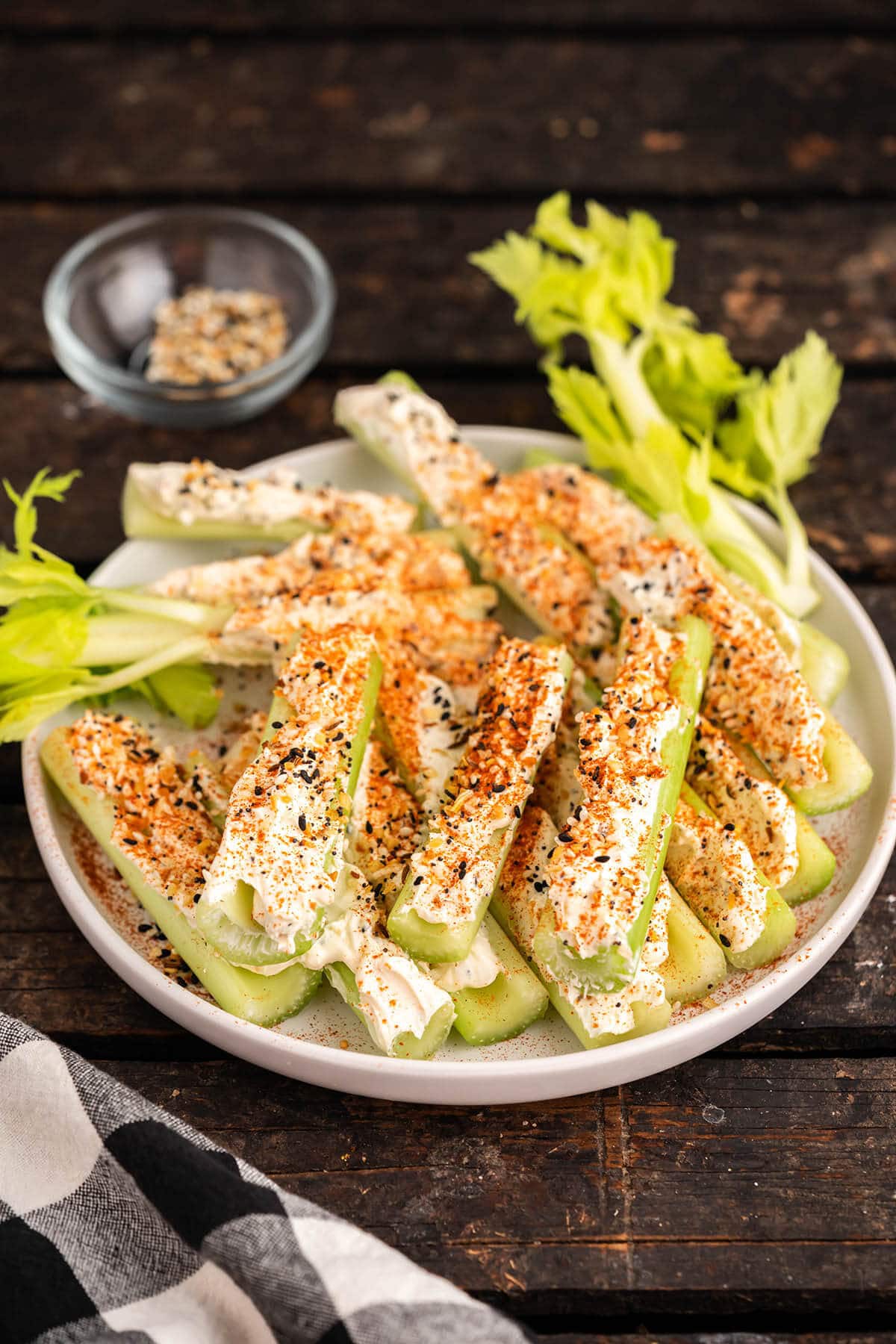 Cream cheese stuffed celery on platter. 