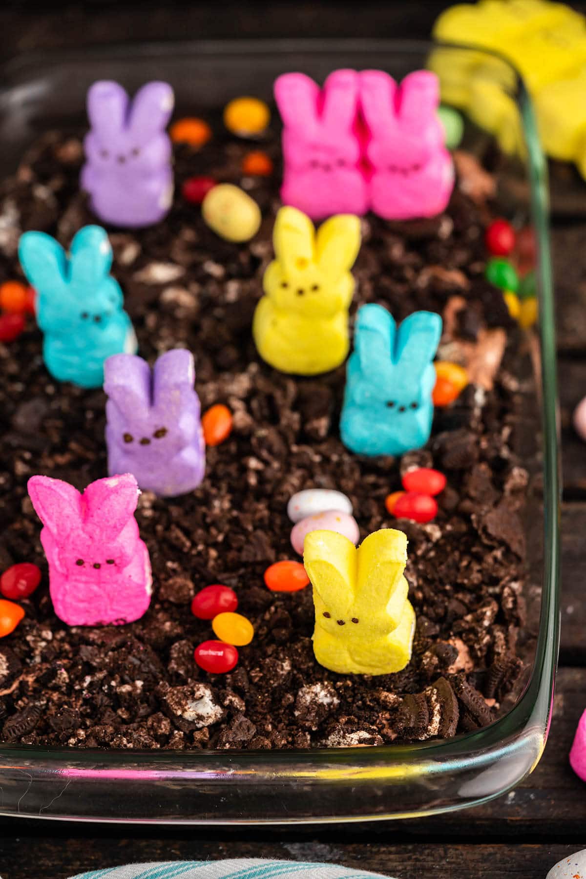 Chocolate dirt cake decorated with peeps and chocolate eggs. 