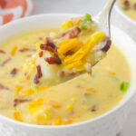 Potato Corn Soup Recipe in bowl with spoon.