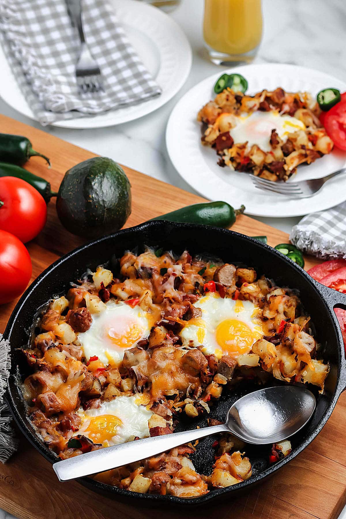 Southwest Breakfast Skillet in cast iron pan with serving spoon.
