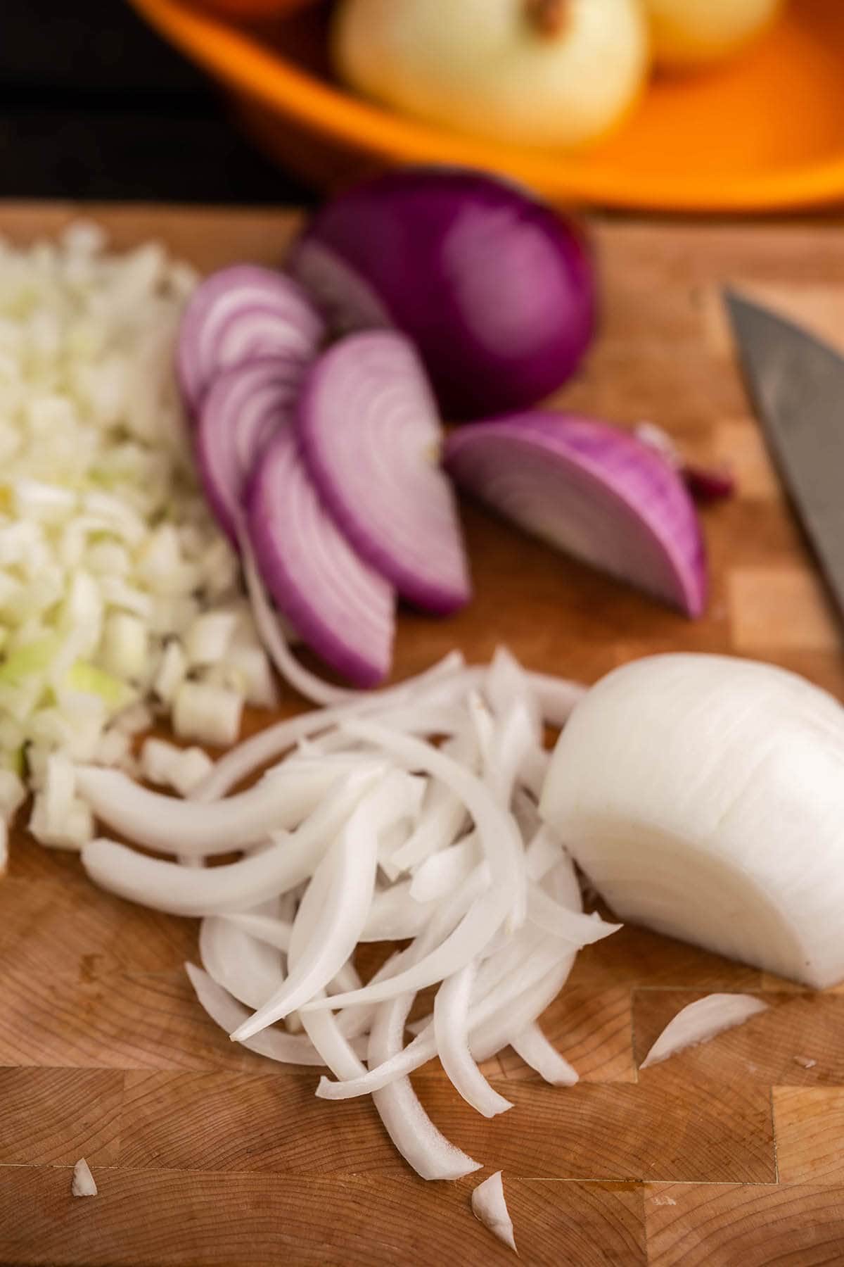 Slivered onions on cutting board.