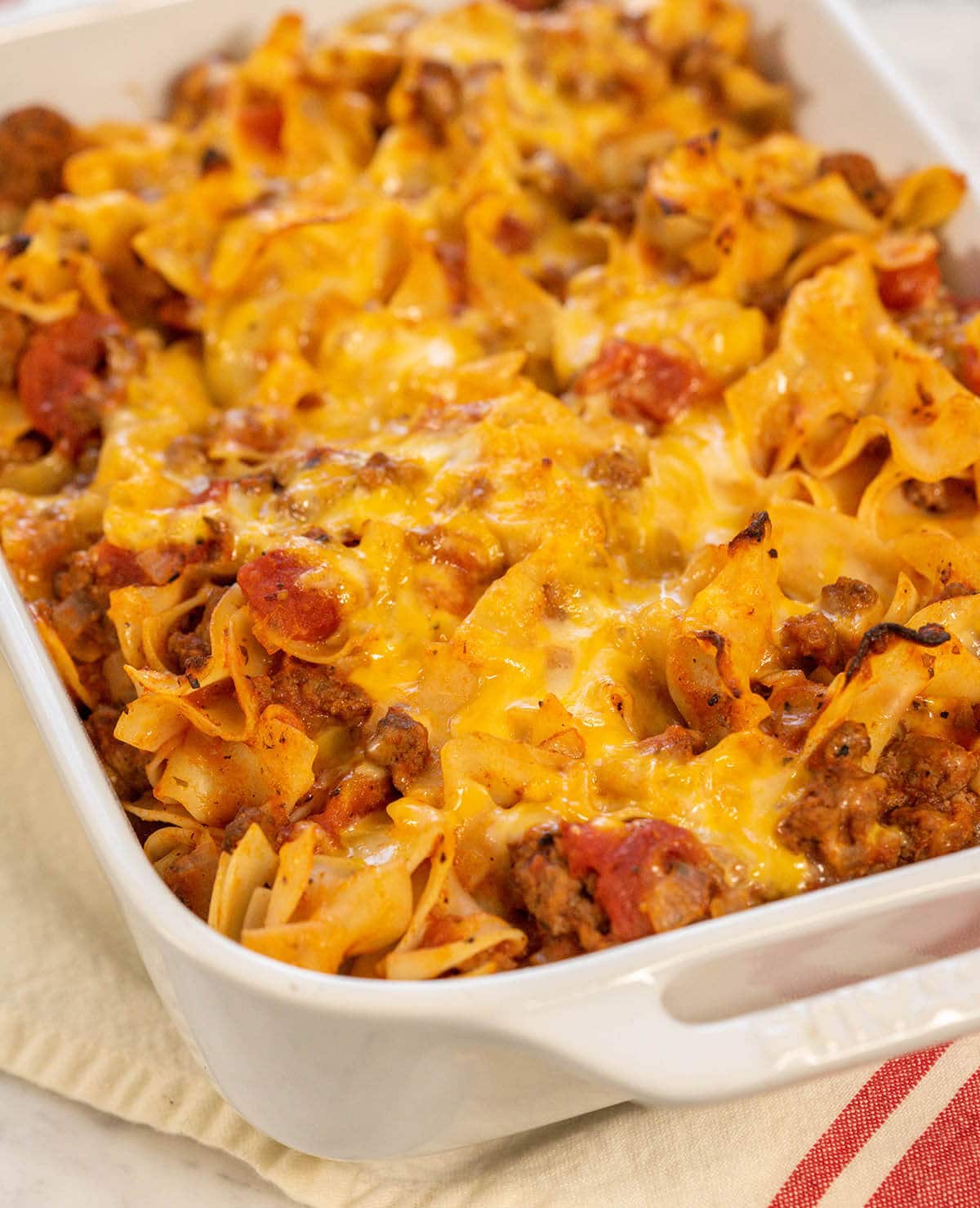 Cheesy beeft noodle casserole in baking dish. 