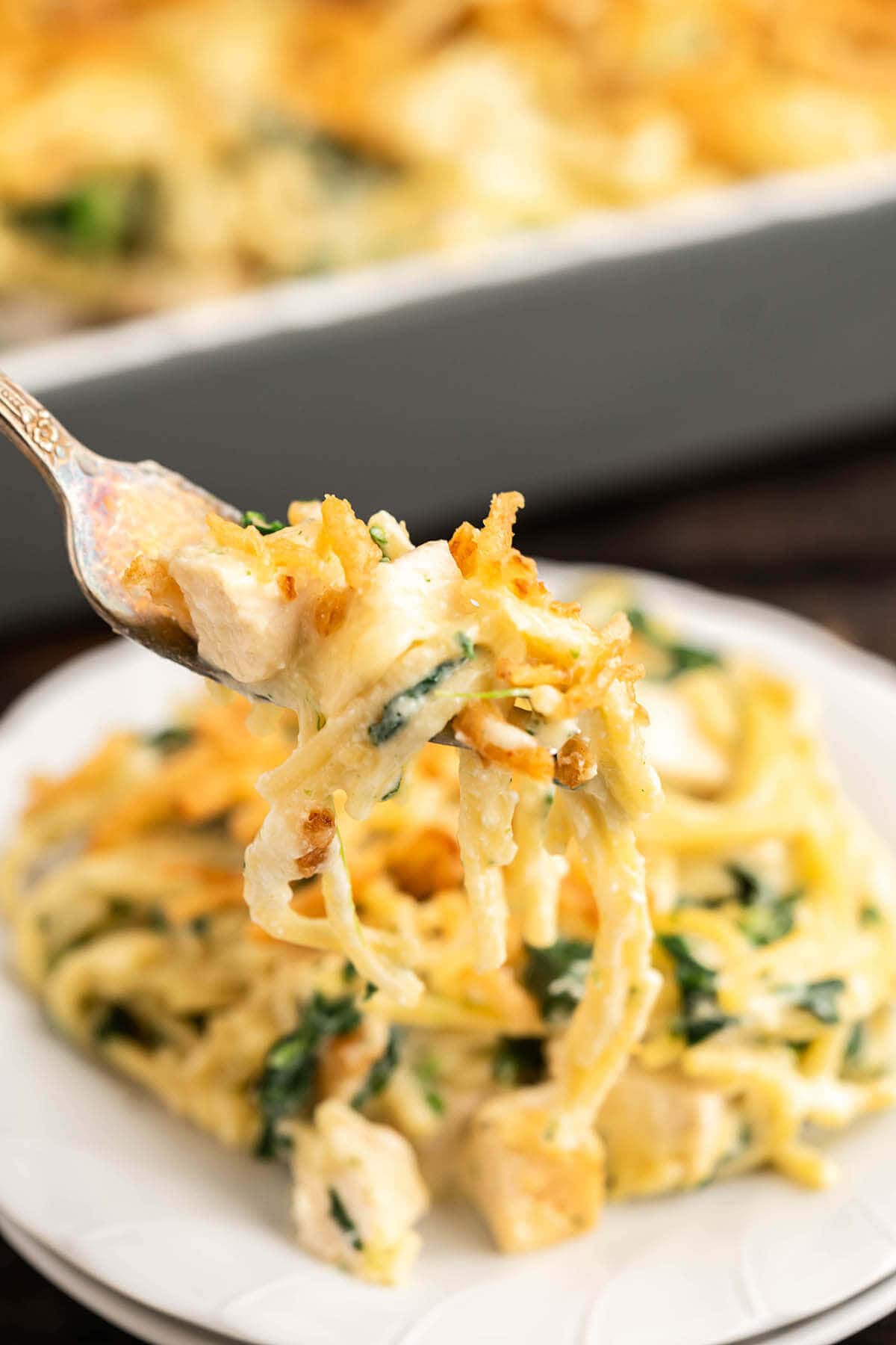 Monterey chicken spaghetti on plate with fork.